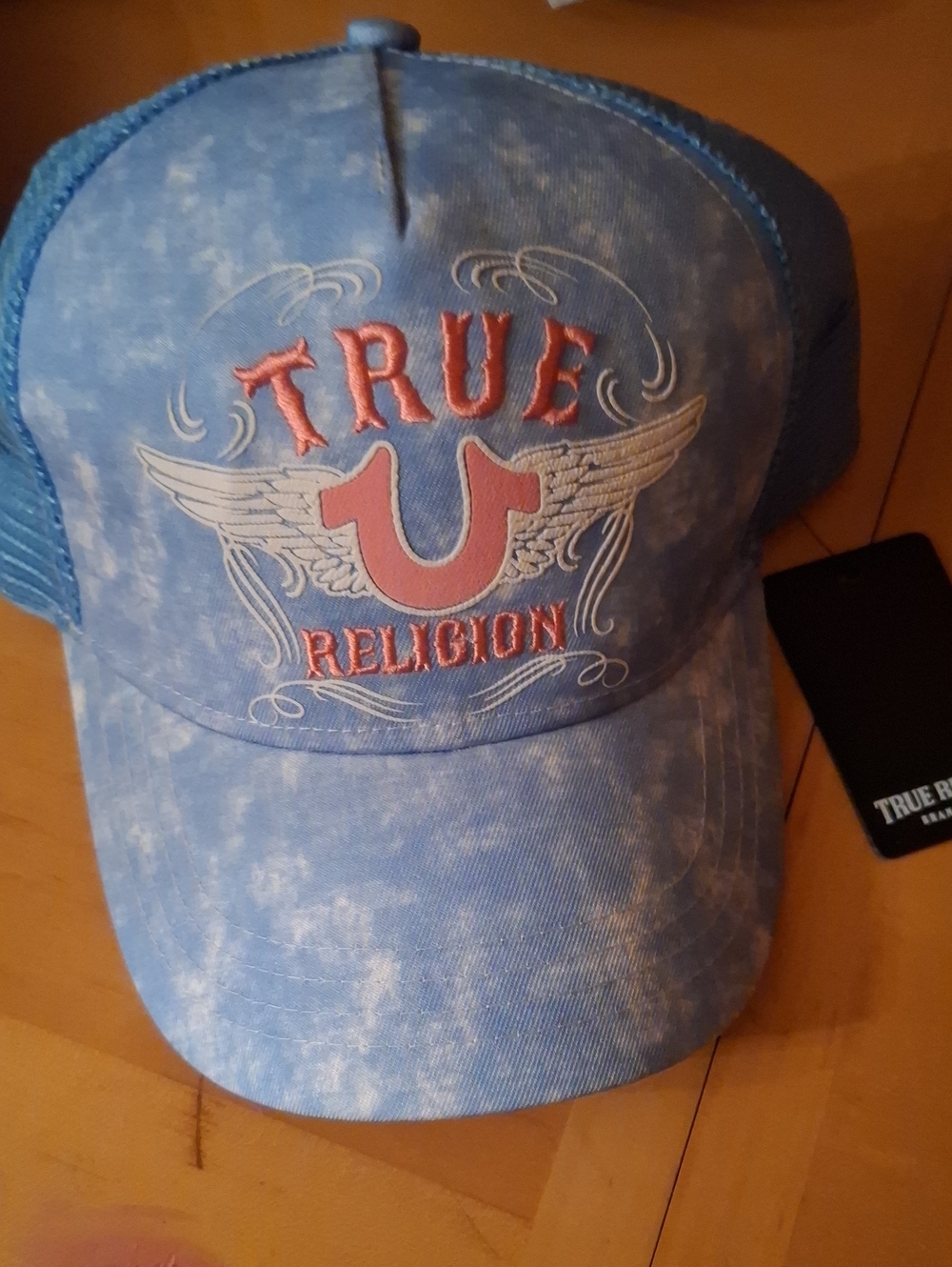 True Religion faded blue logo trucker cap with pink embroidery